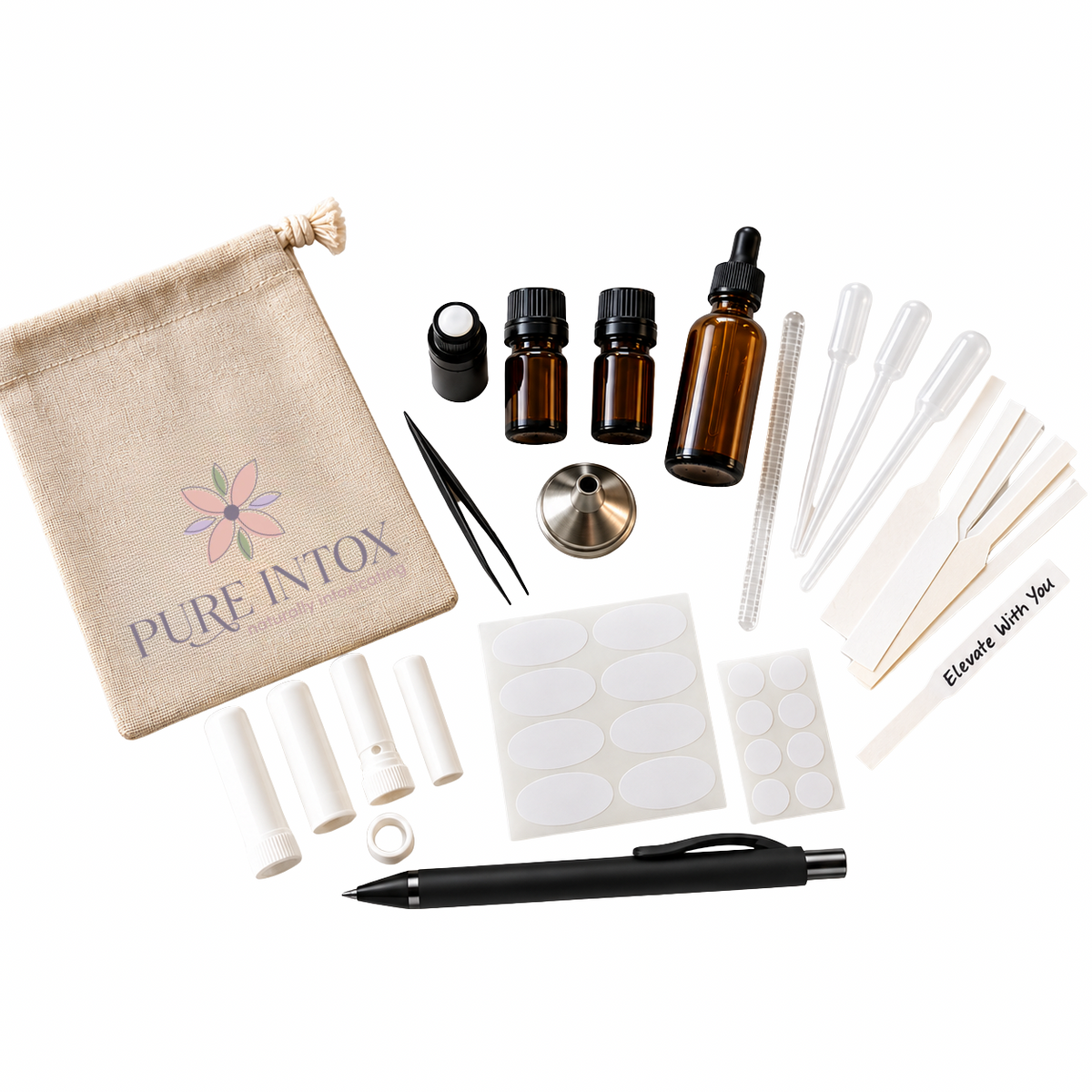 A  Blending  kit by Pure Intox, featuring an amber glass bottle with a dropper, two small amber bottles, a beige canvas drawstring bag with the brand logo, tweezers, white plastic tubes, adhesive labels, a black pen, and other accessories, all arranged on a clean white background.