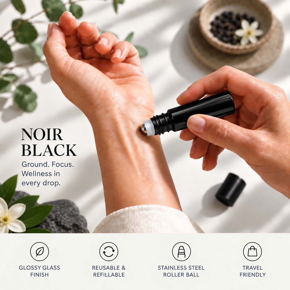 A close-up of a person's hands applying cream from a black roll-on bottle to the back of their hand. The text reads 'NOIR BLACK' with supporting copy about the glossy glass finish, reusable refillable design, stainless steel roller ball, and travel-friendly packaging.
